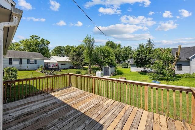 107 Spruce St, Blairstown, IA 52209 - wooden terrace featuring a storage shed, a lawn, and a residential view