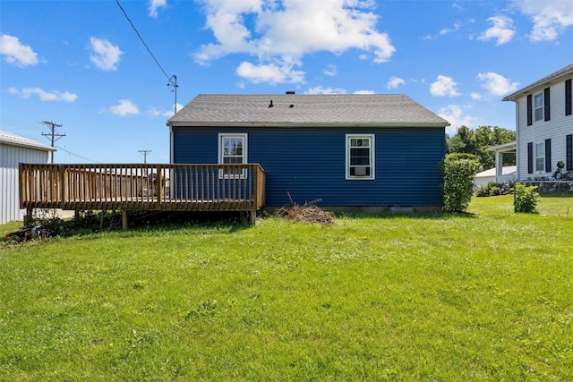 107 Spruce St, Blairstown, IA 52209 - back of property featuring a wooden deck and a lawn