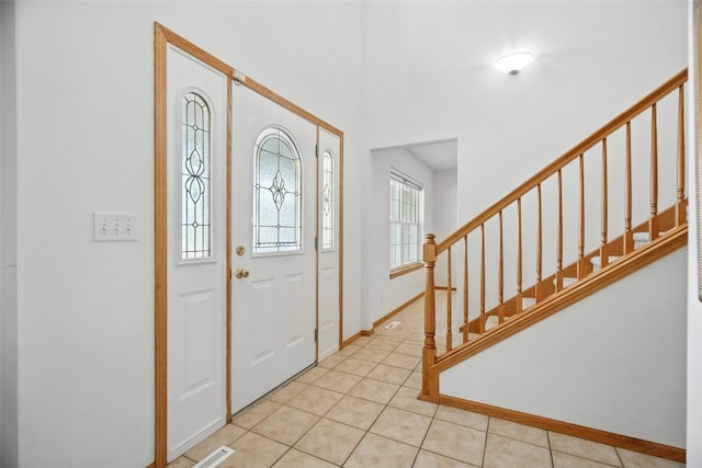 965 Hampshire Dr, Marion, IA 52328 - entryway with stairs and light tile patterned flooring