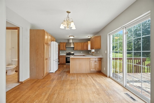 965 Hampshire Dr, Marion, IA 52328 - kitchen with electric range, freestanding refrigerator, a chandelier, light countertops, and a peninsula