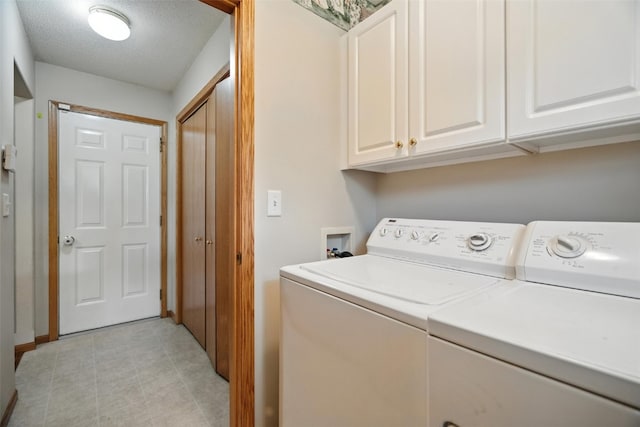 965 Hampshire Dr, Marion, IA 52328 - washroom with independent washer and dryer, cabinet space, and a textured ceiling