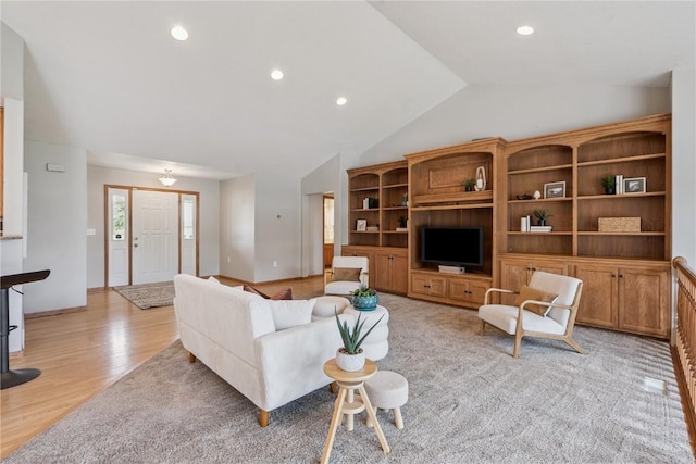 405 Linn Dr, Palo, IA 52324 - living room featuring vaulted ceiling, light wood finished floors, and recessed lighting