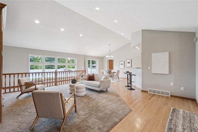 405 Linn Dr, Palo, IA 52324 - living area featuring light wood-style floors, plenty of natural light, recessed lighting, and high vaulted ceiling