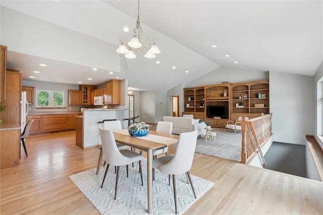 405 Linn Dr, Palo, IA 52324 - dining space with lofted ceiling, light wood finished floors, a chandelier, and recessed lighting