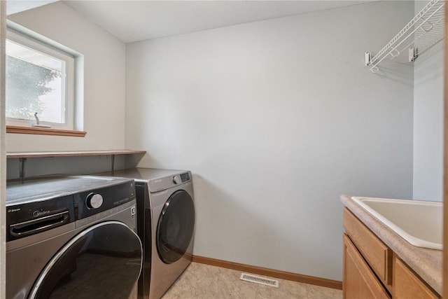 405 Linn Dr, Palo, IA 52324 - washroom with washer and clothes dryer and cabinet space