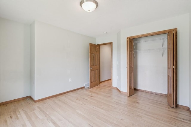 405 Linn Dr, Palo, IA 52324 - unfurnished bedroom with light wood finished floors and a closet