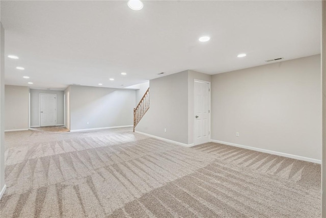 405 Linn Dr, Palo, IA 52324 - finished basement with light carpet, stairway, and recessed lighting