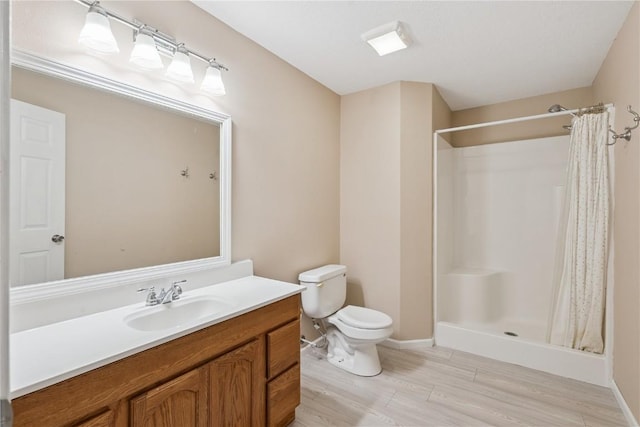 405 Linn Dr, Palo, IA 52324 - bathroom featuring vanity, wood finished floors, and curtained shower