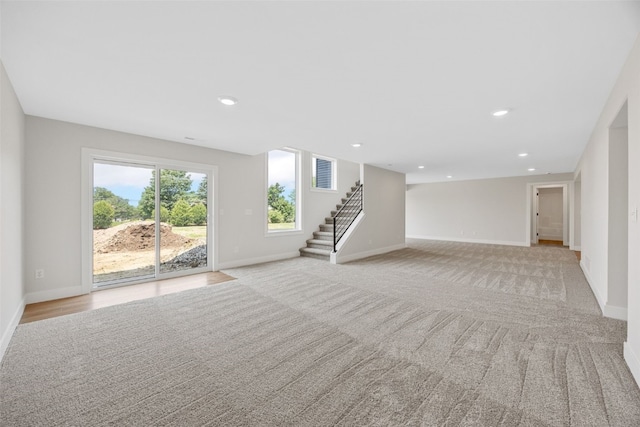 4018 Peridot Dr, Marion, IA 52302 - below grade area featuring stairs, recessed lighting, and light carpet