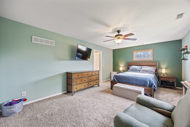 1608 10th St, Coralville, IA 52241 - carpeted bedroom with baseboards and a ceiling fan