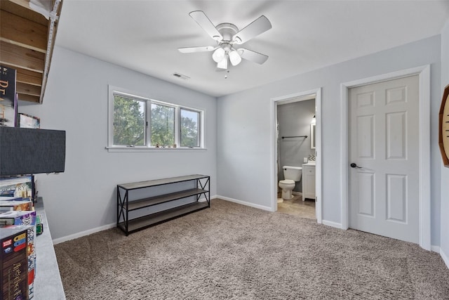 1608 10th St, Coralville, IA 52241 - bedroom with carpet flooring, ensuite bath, and a ceiling fan
