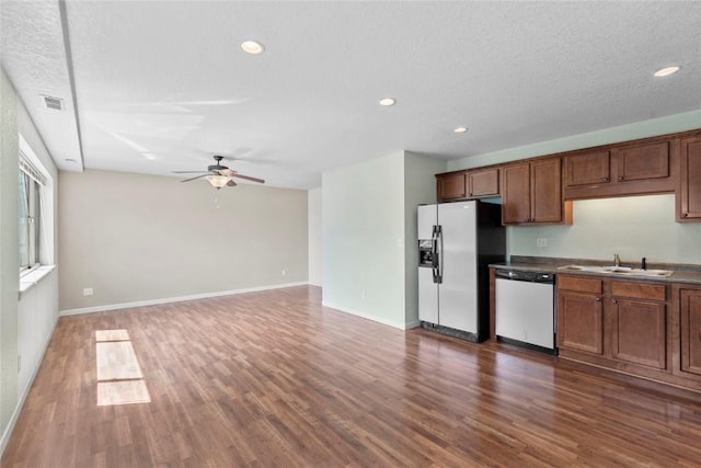 3107 Johnson Ave NW Unit 4, Cedar Rapids, IA 52405 - kitchen featuring white dishwasher, stainless steel fridge with ice dispenser, a ceiling fan, wood finished floors, and recessed lighting