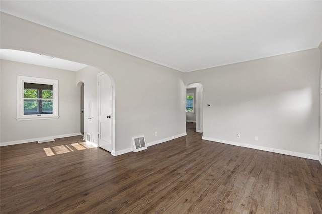 2225 SE Mount Vernon Rd, Cedar Rapids, IA 52403 - unfurnished room featuring dark wood-style floors and arched walkways