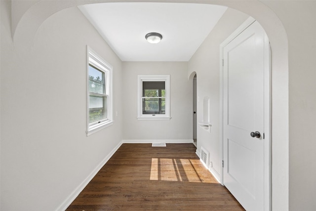 2225 SE Mount Vernon Rd, Cedar Rapids, IA 52403 - hall with dark wood-type flooring and arched walkways