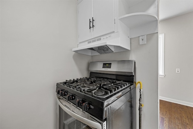 2225 SE Mount Vernon Rd, Cedar Rapids, IA 52403 - kitchen featuring stainless steel range with gas cooktop, under cabinet range hood, white cabinets, and wood finished floors