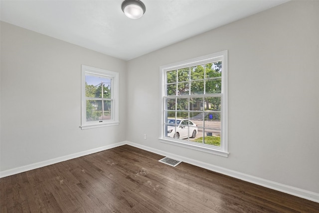 2225 SE Mount Vernon Rd, Cedar Rapids, IA 52403 - empty room featuring baseboards and dark wood-style floors