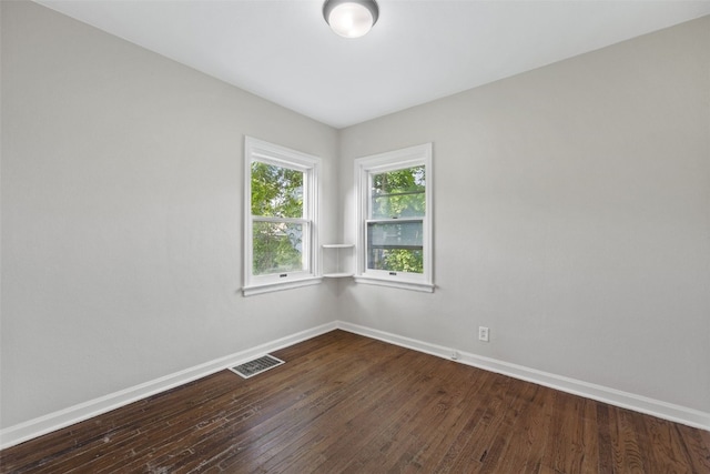2225 SE Mount Vernon Rd, Cedar Rapids, IA 52403 - spare room with baseboards and dark wood-type flooring