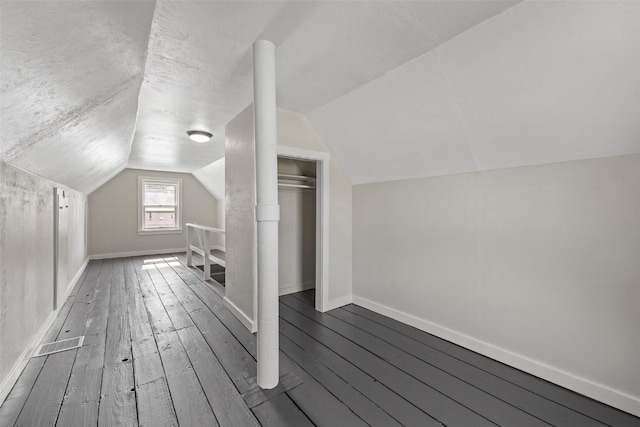 2225 SE Mount Vernon Rd, Cedar Rapids, IA 52403 - bonus room with vaulted ceiling and hardwood / wood-style flooring