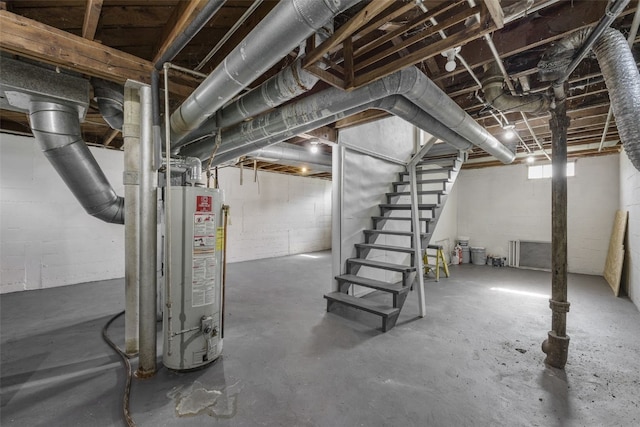 2225 SE Mount Vernon Rd, Cedar Rapids, IA 52403 - basement with gas water heater, stairs, and concrete block wall