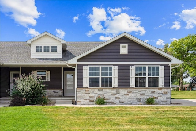 3016 Sherwood Dr, Marion, IA 52302 - view of front of property featuring a front yard, stone siding, roof with shingles, and covered porch