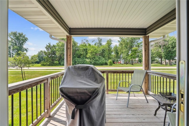 3016 Sherwood Dr, Marion, IA 52302 - wooden deck featuring a lawn, grilling area, and view of wooded area