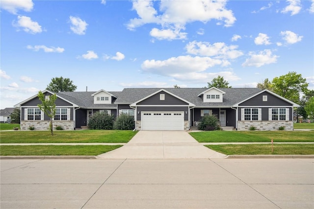 3016 Sherwood Dr, Marion, IA 52302 - craftsman-style house featuring stone siding, a garage, a front lawn, and driveway
