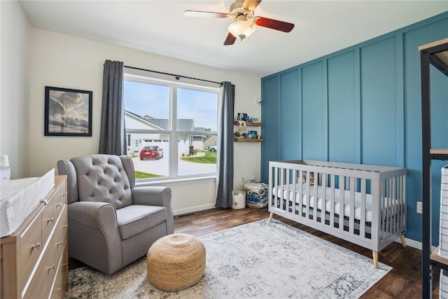 3016 Sherwood Dr, Marion, IA 52302 - bedroom with wood finished floors, a nursery area, and ceiling fan