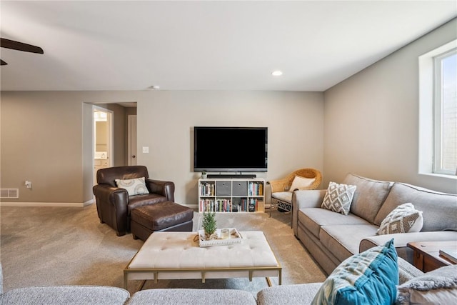 3016 Sherwood Dr, Marion, IA 52302 - living area with light colored carpet, ceiling fan, and recessed lighting