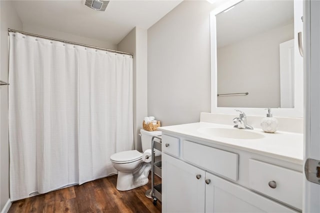 3016 Sherwood Dr, Marion, IA 52302 - bathroom with vanity, wood finished floors, and curtained shower