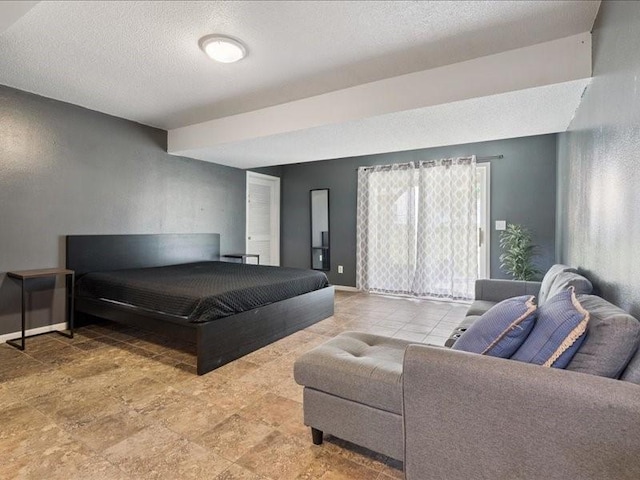 2007 S Ridge Dr, Coralville, IA 52241 - bedroom with a textured ceiling and baseboards
