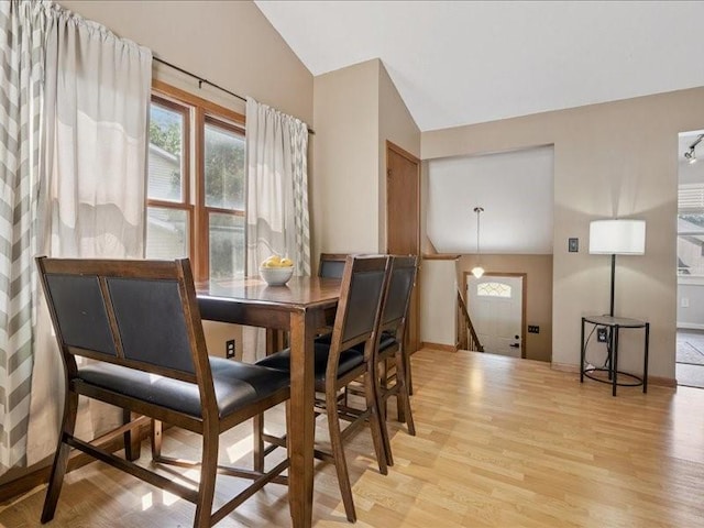 2007 S Ridge Dr, Coralville, IA 52241 - dining space featuring lofted ceiling, light wood-style floors, and healthy amount of natural light