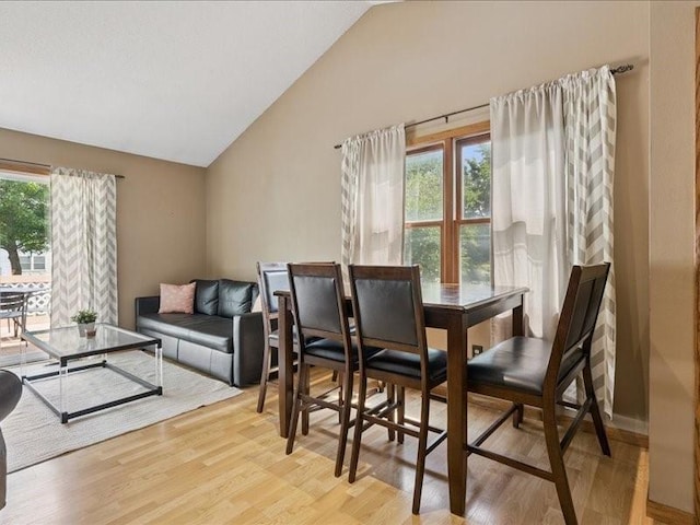 2007 S Ridge Dr, Coralville, IA 52241 - dining space with vaulted ceiling and light wood-style flooring