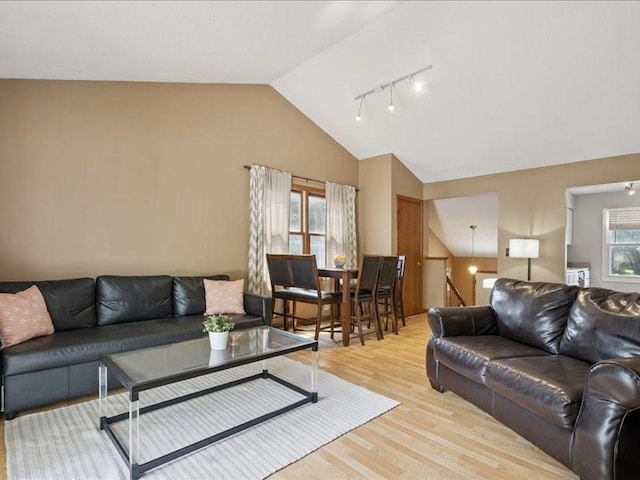 2007 S Ridge Dr, Coralville, IA 52241 - living area with light wood finished floors, rail lighting, and high vaulted ceiling