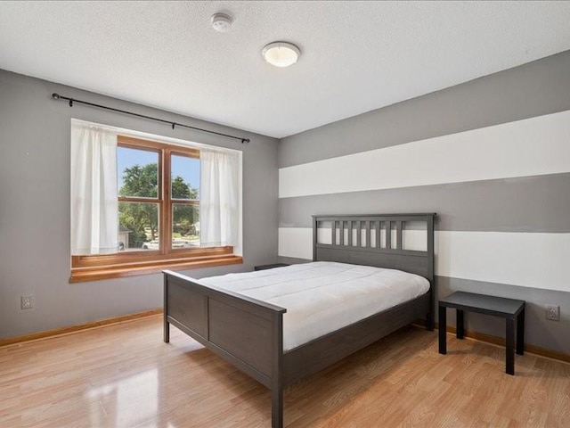 2007 S Ridge Dr, Coralville, IA 52241 - bedroom with wood finished floors and a textured ceiling