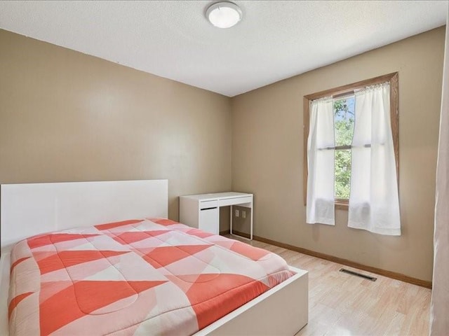 2007 S Ridge Dr, Coralville, IA 52241 - bedroom featuring wood finished floors and baseboards