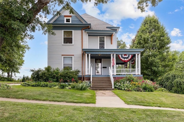 103 10th Ave SW, Mount Vernon, IA 52314 - victorian house with a porch and a front lawn