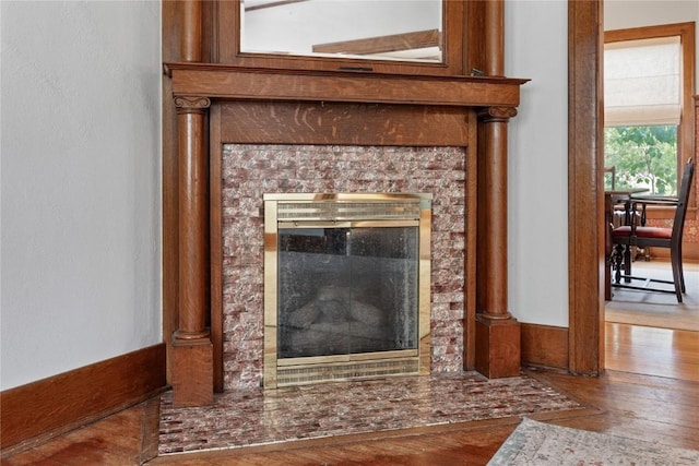 103 10th Ave SW, Mount Vernon, IA 52314 - detailed view of wood finished floors and a tiled fireplace