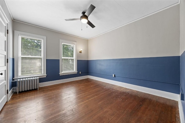 103 10th Ave SW, Mount Vernon, IA 52314 - empty room featuring radiator heating unit, ceiling fan, hardwood / wood-style floors, and crown molding