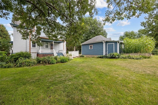 103 10th Ave SW, Mount Vernon, IA 52314 - view of green lawn with a porch and an outbuilding