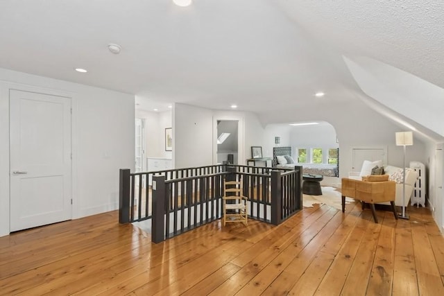 404 Brown St, Iowa City, IA 52245 - bonus room with light wood-type flooring, recessed lighting, and lofted ceiling