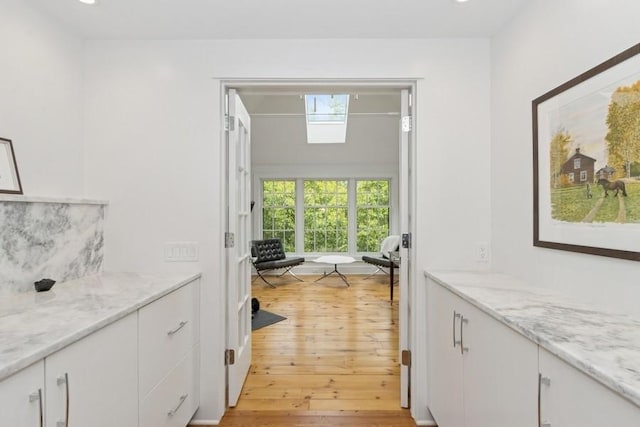 404 Brown St, Iowa City, IA 52245 - corridor featuring light wood finished floors and recessed lighting