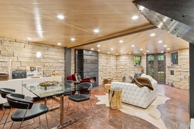 404 Brown St, Iowa City, IA 52245 - interior space featuring a glass covered fireplace, wooden ceiling, recessed lighting, and finished concrete flooring