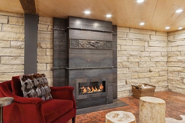 404 Brown St, Iowa City, IA 52245 - living area with a glass covered fireplace, recessed lighting, and wooden ceiling