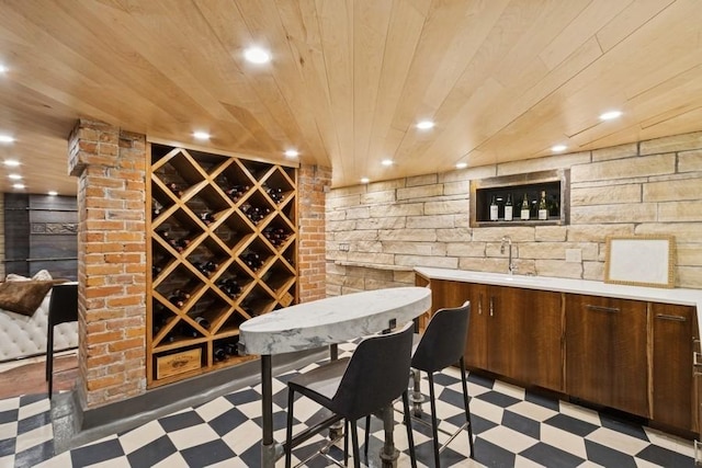 404 Brown St, Iowa City, IA 52245 - wine room with light flooring, wood ceiling, bar area, and recessed lighting