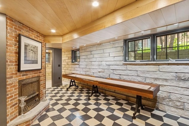 404 Brown St, Iowa City, IA 52245 - playroom with tile patterned floors, wood ceiling, an outdoor brick fireplace, and recessed lighting