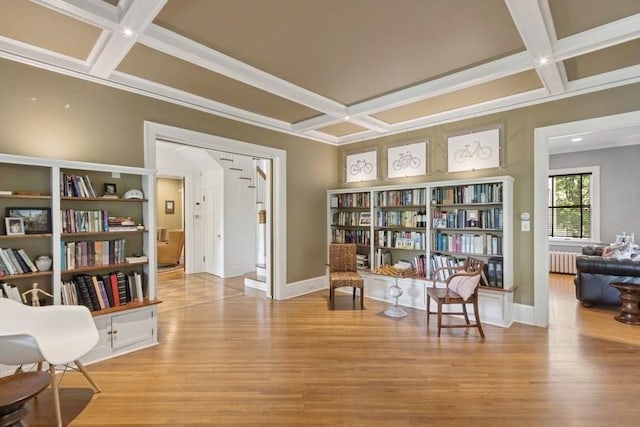 404 Brown St, Iowa City, IA 52245 - sitting room with coffered ceiling, radiator heating unit, wood finished floors, and beam ceiling