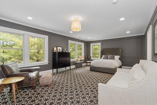 404 Brown St, Iowa City, IA 52245 - carpeted bedroom featuring ornamental molding, recessed lighting, and a decorative wall