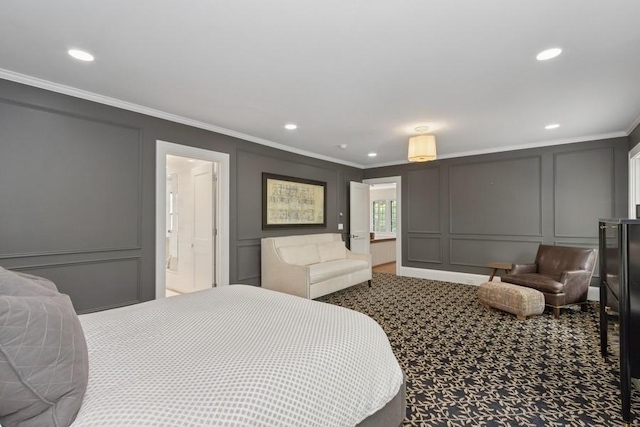 404 Brown St, Iowa City, IA 52245 - carpeted bedroom featuring a decorative wall, ornamental molding, and recessed lighting