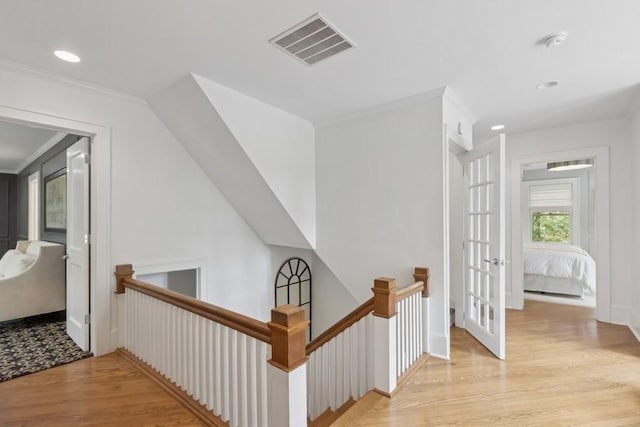 404 Brown St, Iowa City, IA 52245 - corridor with an upstairs landing, crown molding, wood finished floors, and recessed lighting