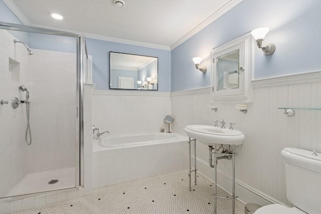 404 Brown St, Iowa City, IA 52245 - bathroom featuring a bath, a shower stall, wainscoting, crown molding, and tile patterned flooring